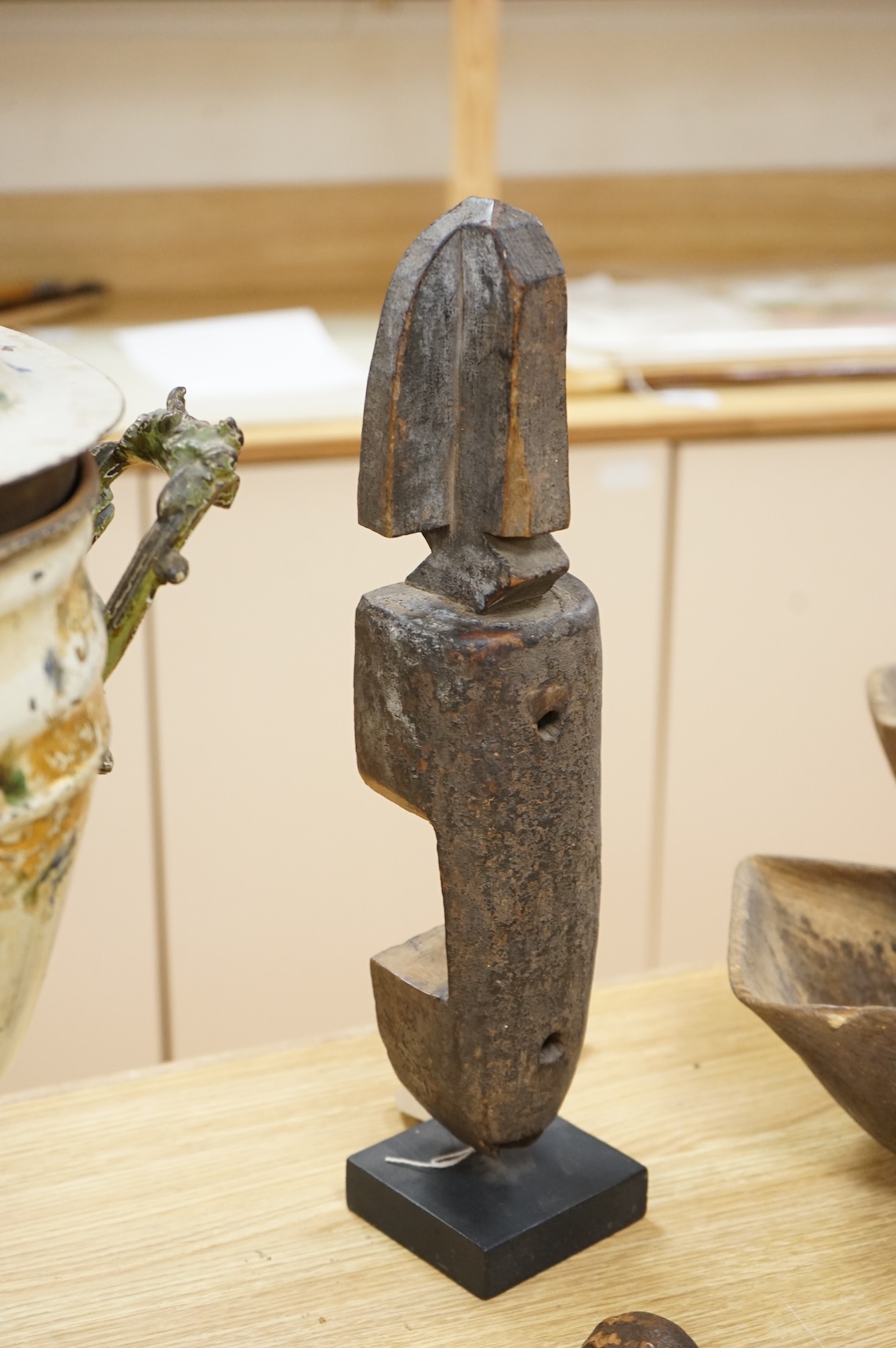 Tribal interest; A collection of various African carvings, a basket and spear